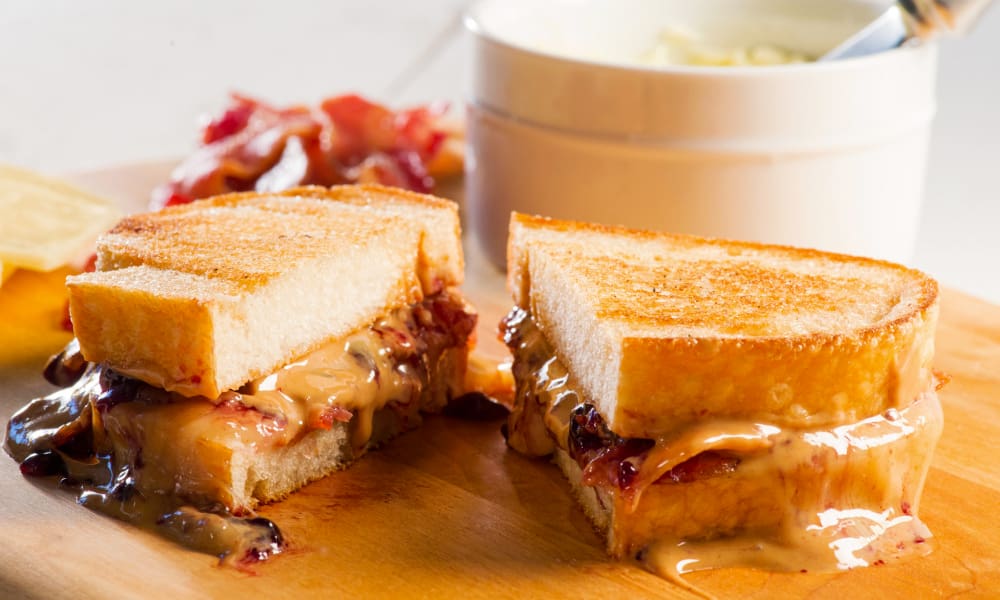 Luscious melted sharp white Cheddar cheese, salty crispy bacon, creamy peanut butter and a touch of sweet blackberry preserves!