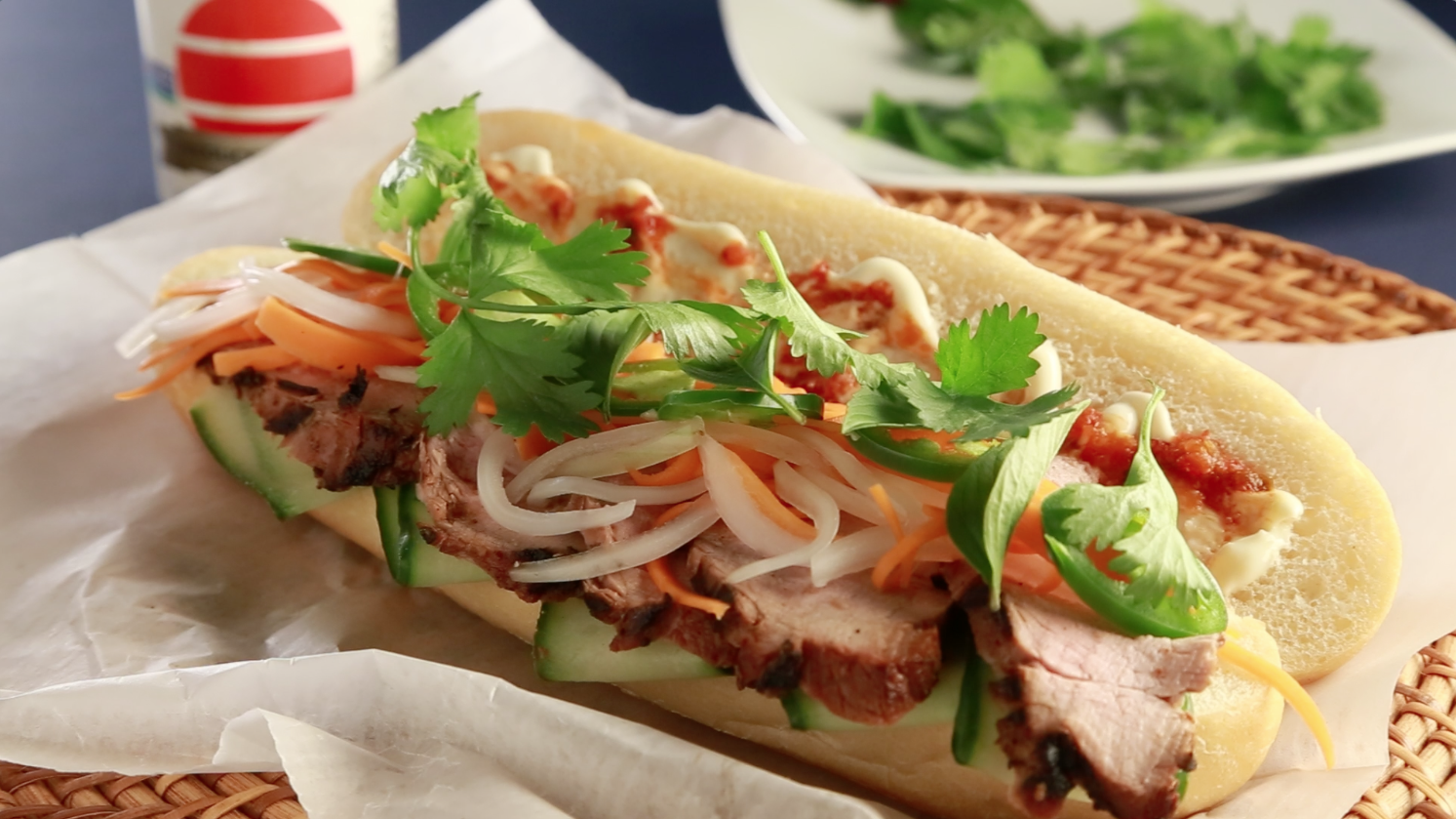 This spicy-fresh Vietnamese sandwich layers thin slices of tender marinated grilled pork tenderloin with crunchy pickled veggies, fresh-cut jalapeno, thin ribbons of cucumber and spicy chile mayo on a French baguette. Banh Mi perfection crafted in the Food Channel�s very own kitchen!