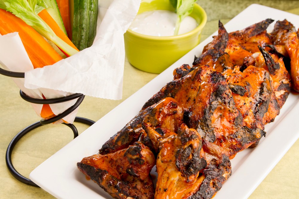 Grilled wings are a healthier alternative to fried wings, but just as satisfying. Use your favorite cayenne pepper sauce, and serve these with a chunky blue cheese dressing. Be sure to have hot crusty bread for dipping in the delicious wing sauce.ย