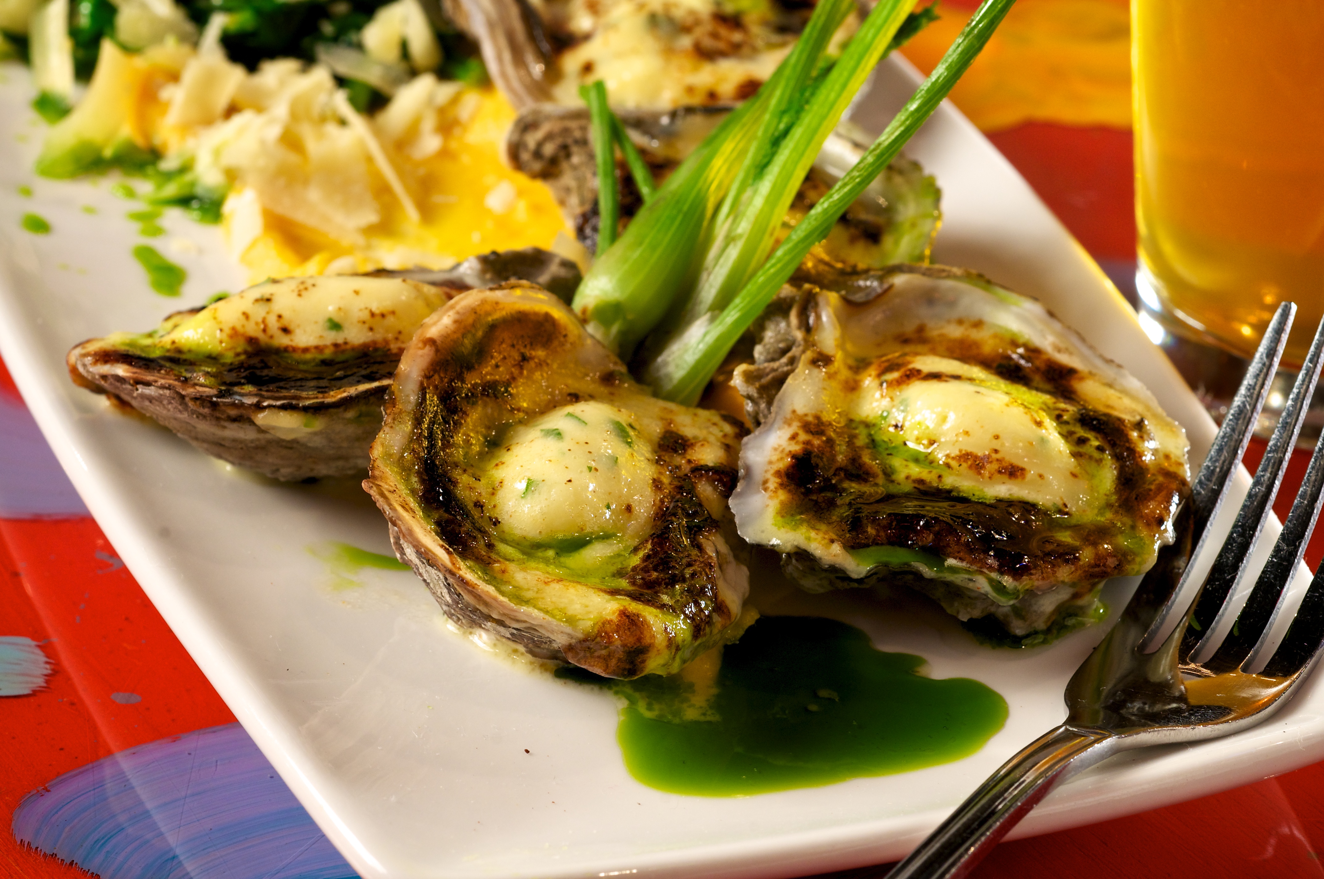 Parmesan and Dijon glazed oysters with a butternut squash puree, Herbsaint flamed spinach and grilled baby fennel. This dish pays homage to some of the classic flavors of Oyster Rockefeller with the use of spinach, parmesan and Herbsaint, while using different techniques to pair those flavors with Gulf oysters.