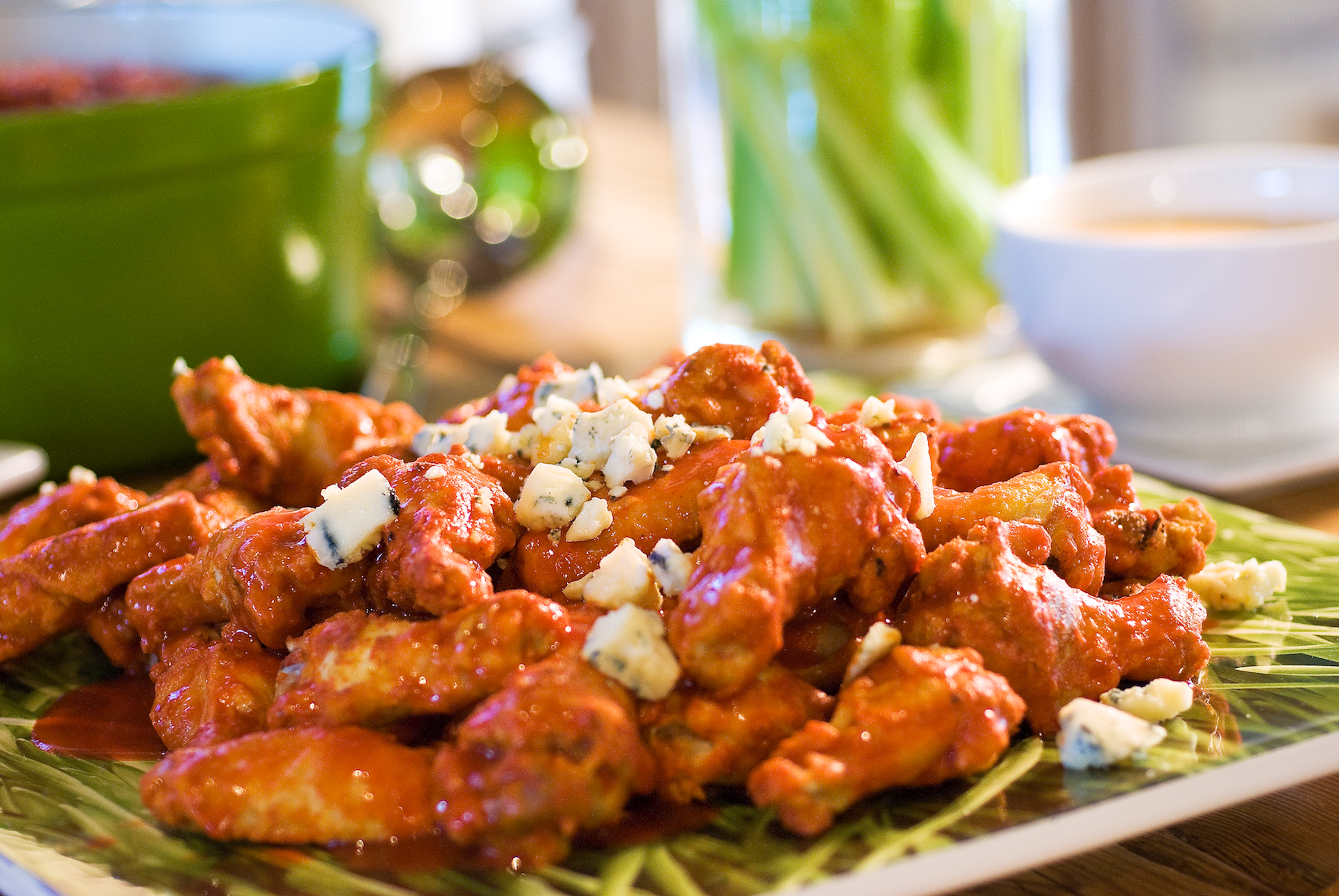 Golden crispy hot wings smothered in buttery, hot-and-spicy Buffalo wing sauce and crumbled blue cheese.