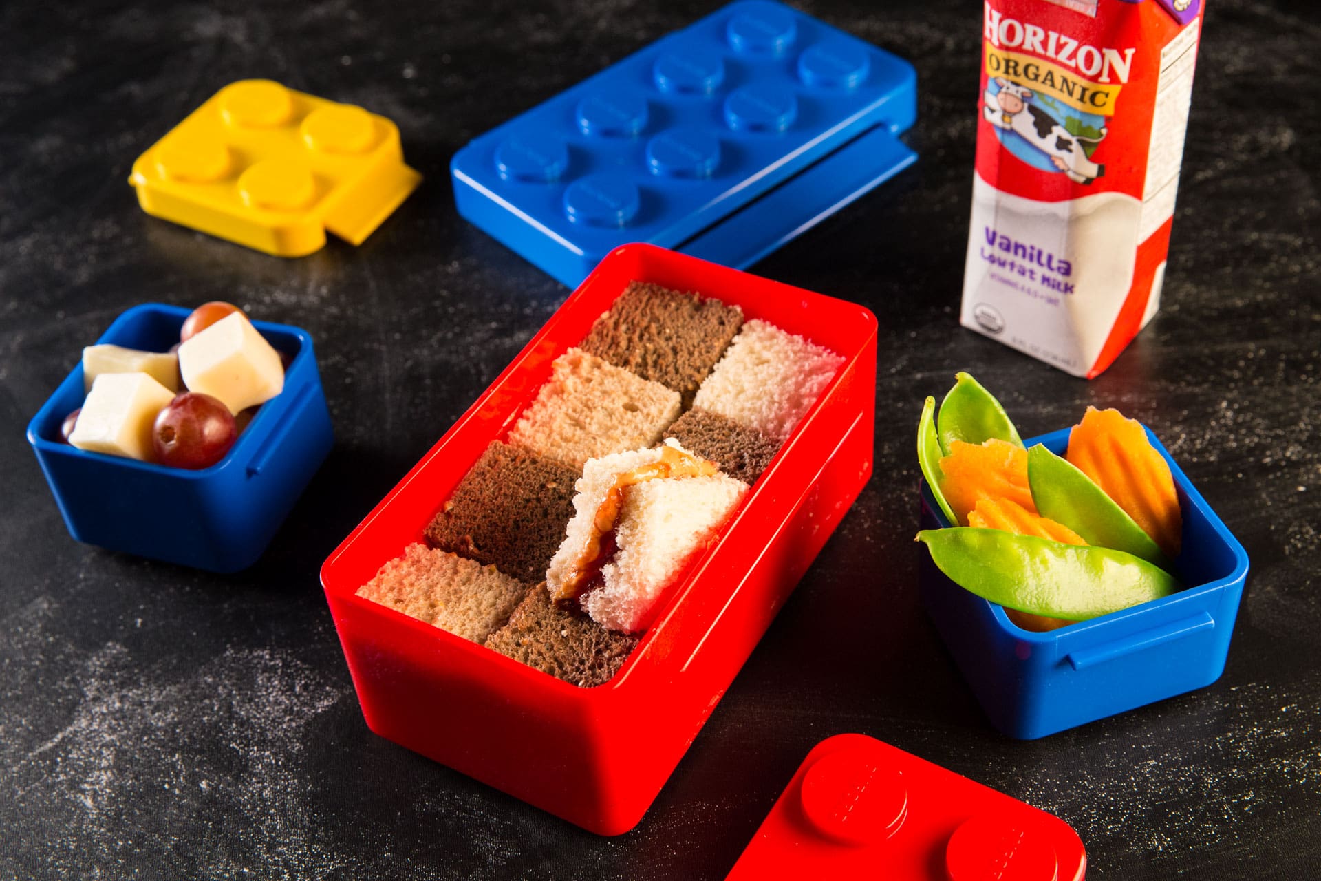 This fun sandwich features creamy peanut butter and strawberry preserves layered on bite-size squares of wheat, white and pumpernickel bread arranged in a checkerboard pattern!