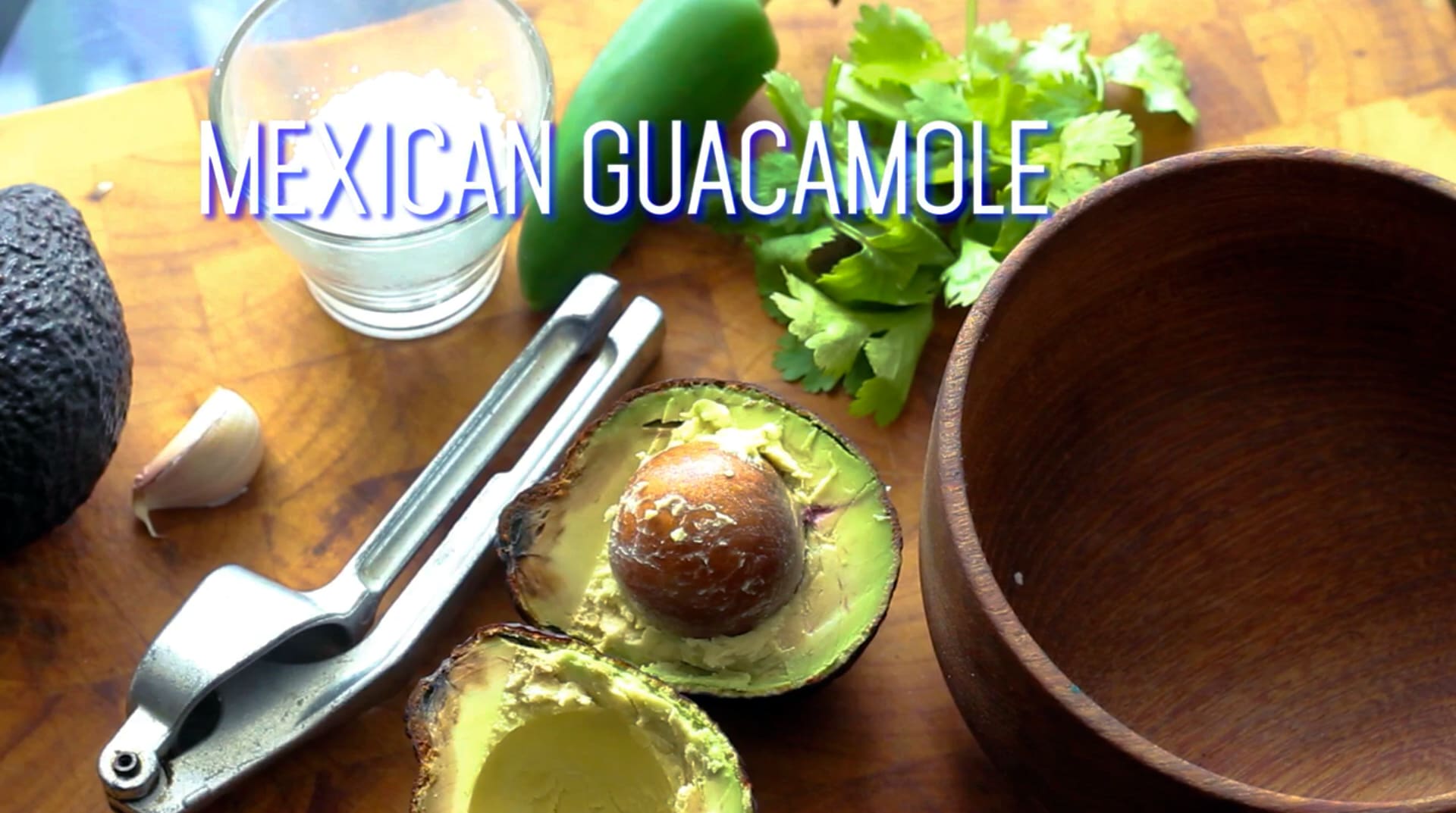 picture of a table top with a bowl and fresh avocados