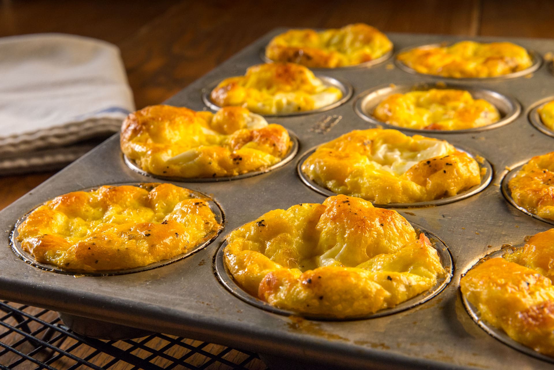 These make-ahead portable breakfast muffins keep it quick and easy to get the kids out the door with a warm and nutritious, protein-rich, breakfast on a hectic school day morning.