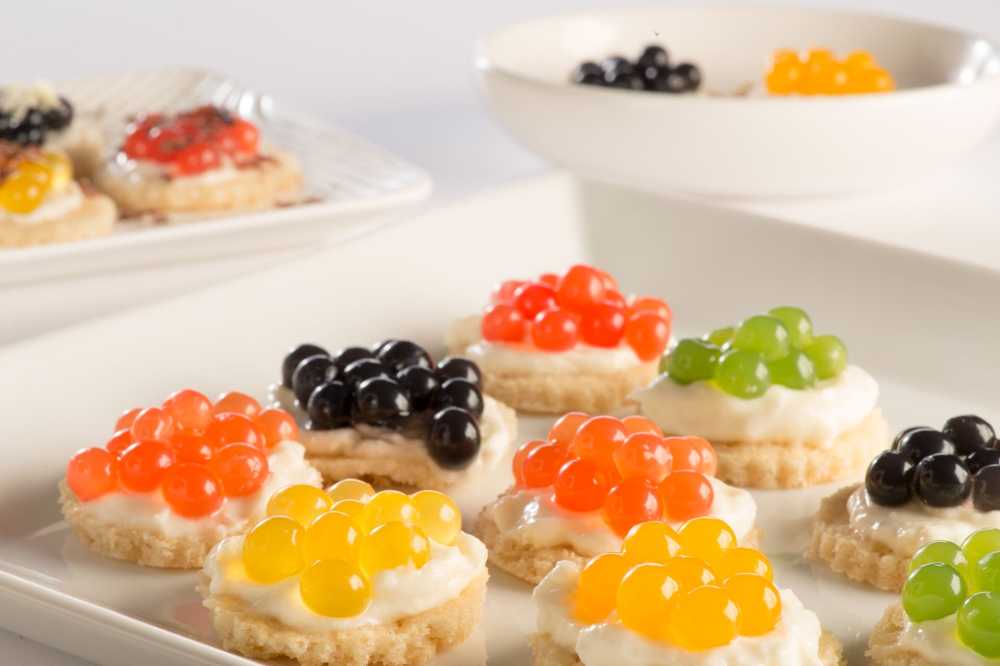 photo of crackers topped with boba flavor pearls that looks like caviar for kids