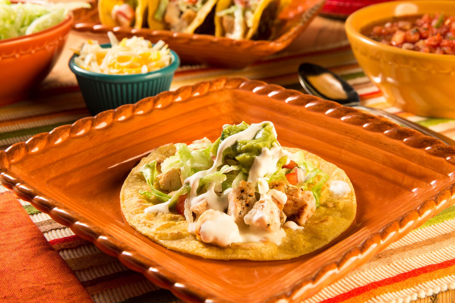 Perfect for a busy night, this fun recipe uses leftover grilled chicken seasoned with Mexican seasoning, topped with white queso sauce and stuffed in a crisp skillet-griddled corn tortilla taco. Taco Tuesdays are anything but boring and a fun way to celebrate with a school-related theme.