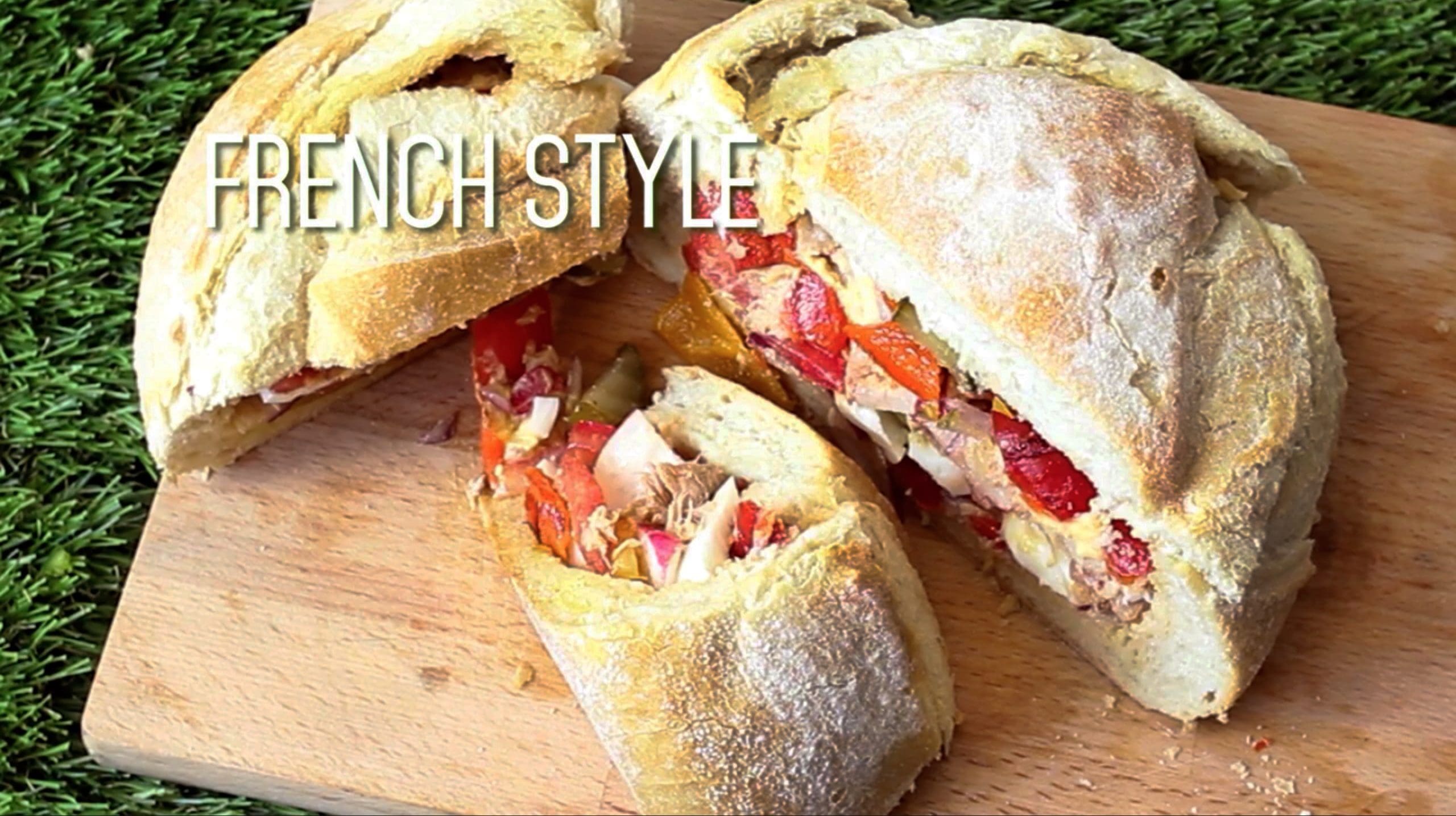 Picnic loaf sandwich made by hollowing out a loaf of bread and stuffing with a variety of fillings.