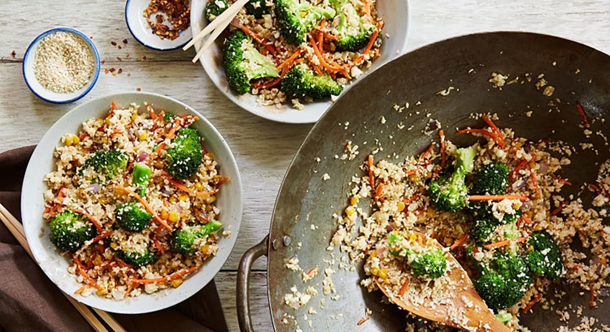 This mouthwatering Cauliflower Fried Rice is made by combining the fresh flavors of cauliflower rice, broccoli, carrots, corn, red onion and Asian spices, into one dish that is bursting with flavor. From start to finish, this dish only takes 20 minutes to create.