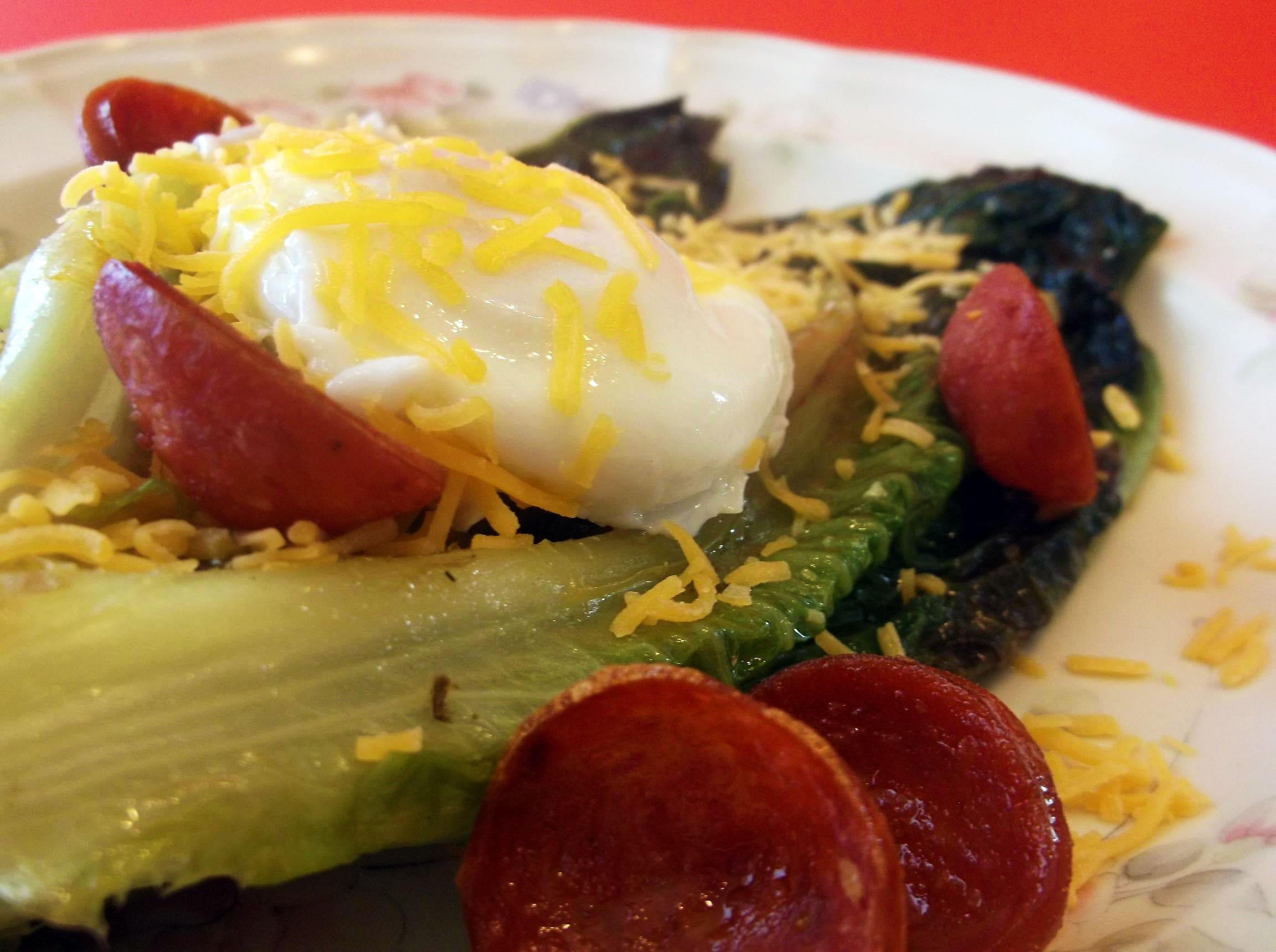 Lettuce for breakfast? I love it. And when cooked in the flavor from Andouille and then taking a bite of warm egg yolk... well, it jump-started my day. But you can enjoy this recipe for dinnertime as well.