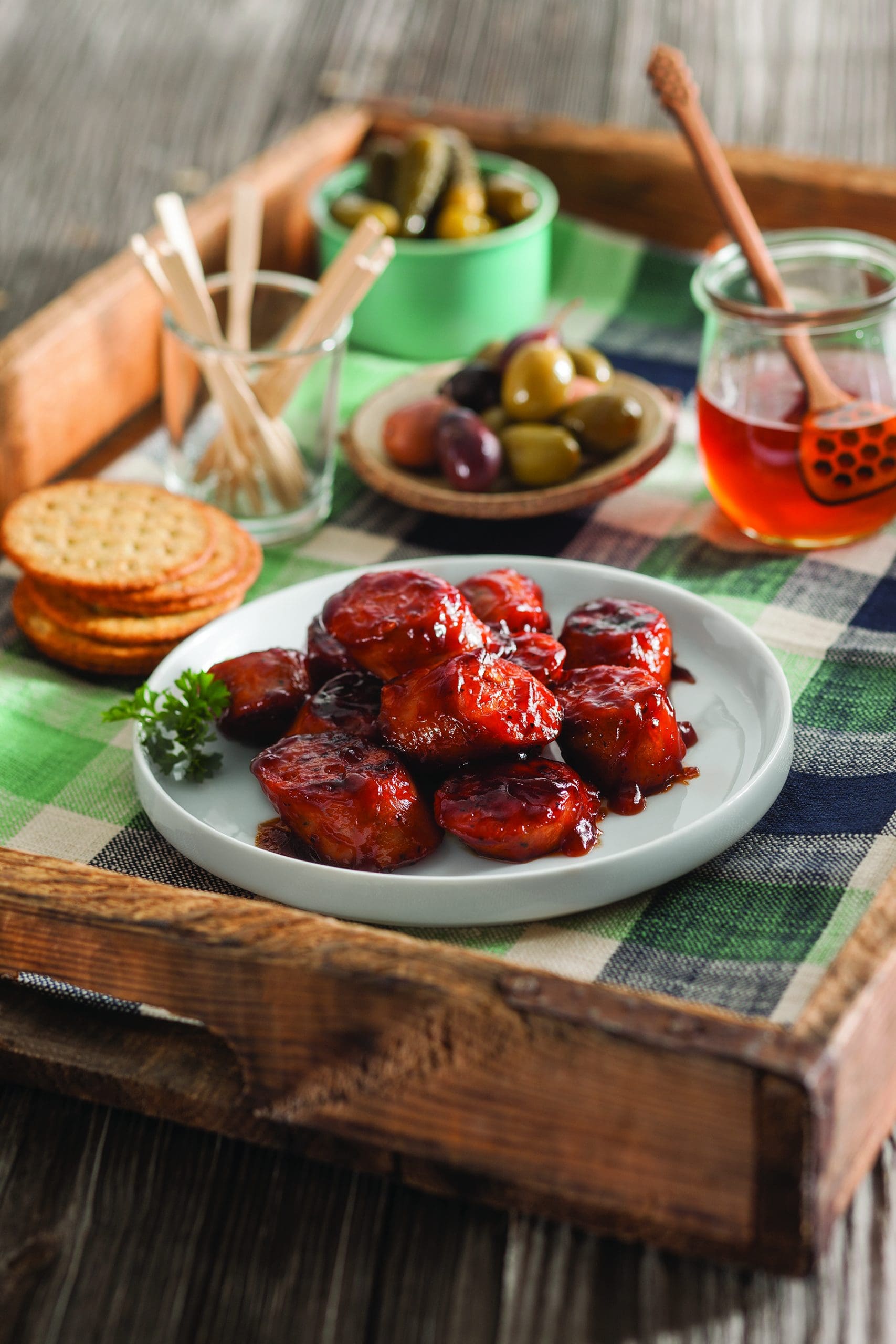 These party franks are so simple and easy to make, they'll be a staple dish for every potluck you attend! Made with chicken or turkey frankfurters smothered in barbecue sauce, honey, dry mustard and ginger, this party appetizer is bursting with tangy, delicious flavor.