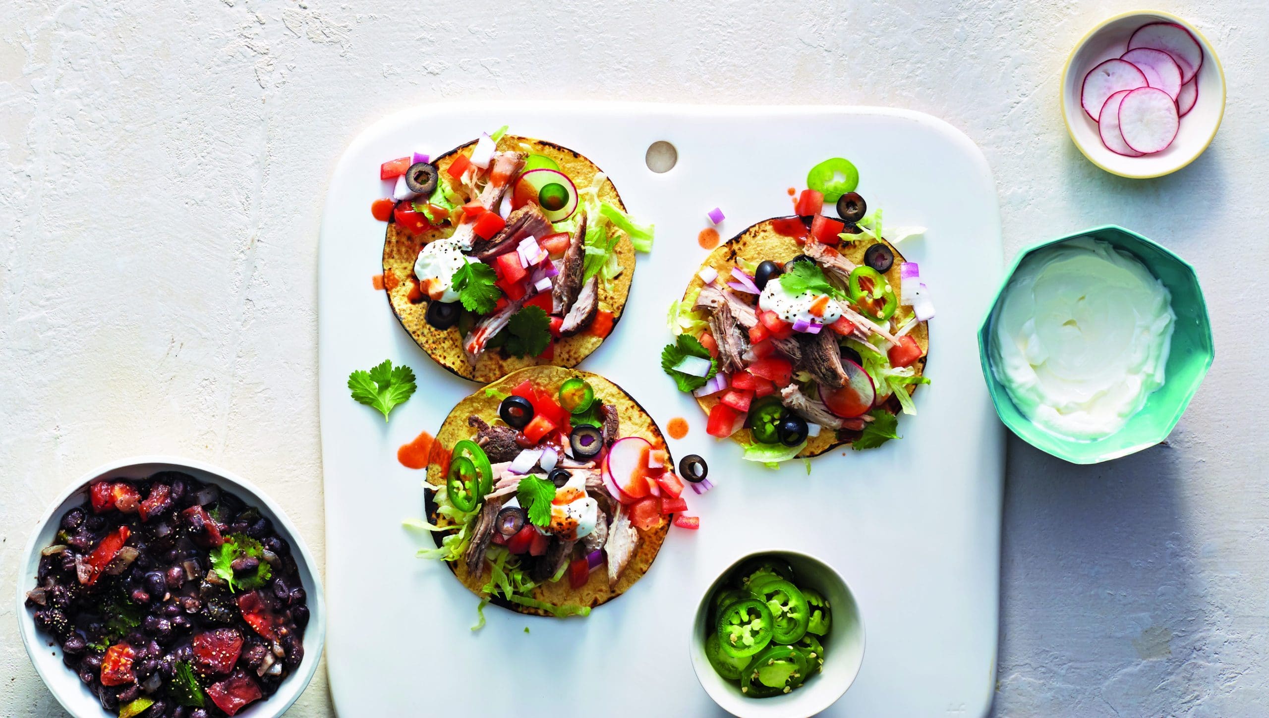 These smoked pork butt carnitas are quick to prepare in a crockpot, but will need some time to reach maximum perfection - and trust us, they're worth it.