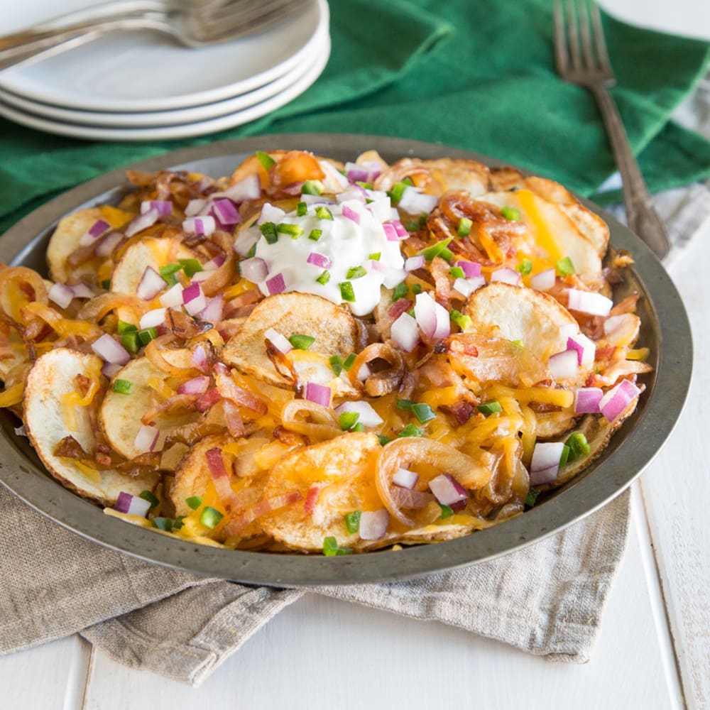Add a creative twist your St. Patrick’s Day menu this year with these Irish Nachos! Why Irish? Homemade potato chips serve as the base instead of tortilla chips!