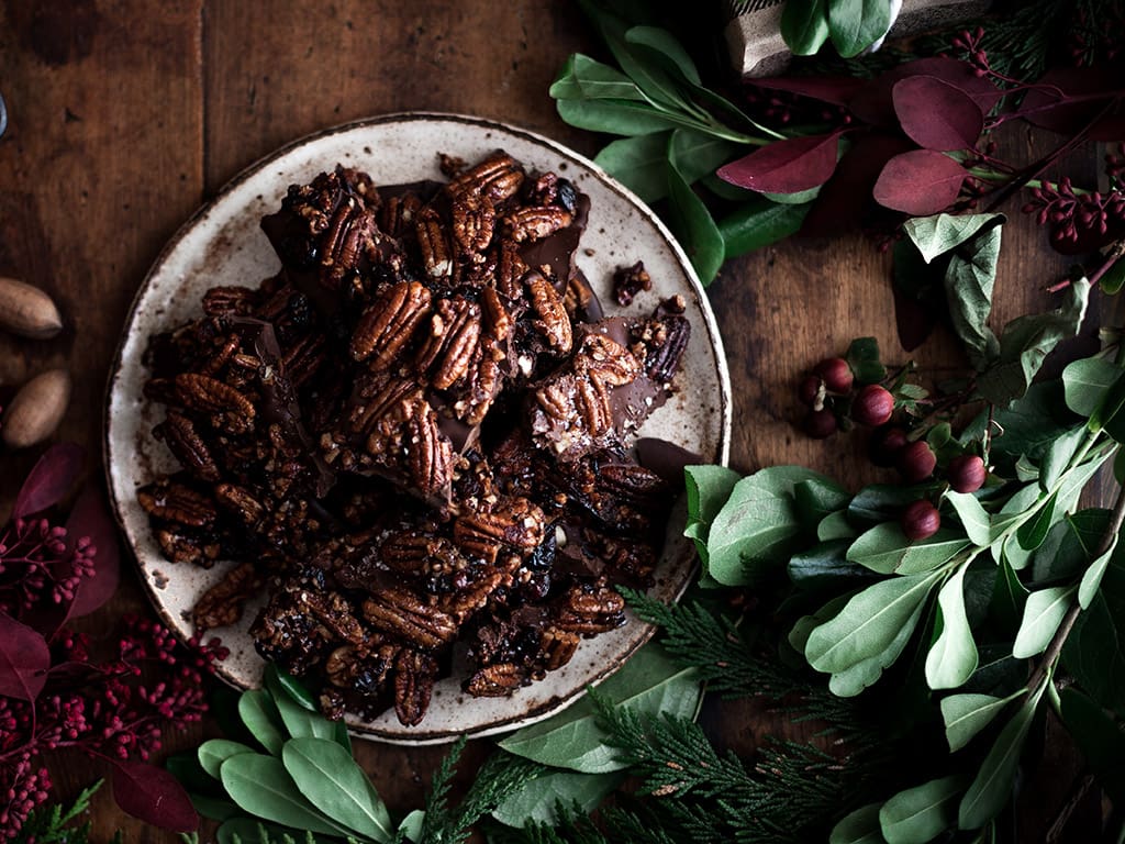 This Maple Pecan Superfood Bark is made with dark chocolate and topped with crispy, crunchy, maple-glazed pecans and dried cranberries, spiced with black pepper, cinnamon, orange zest, and vanilla!