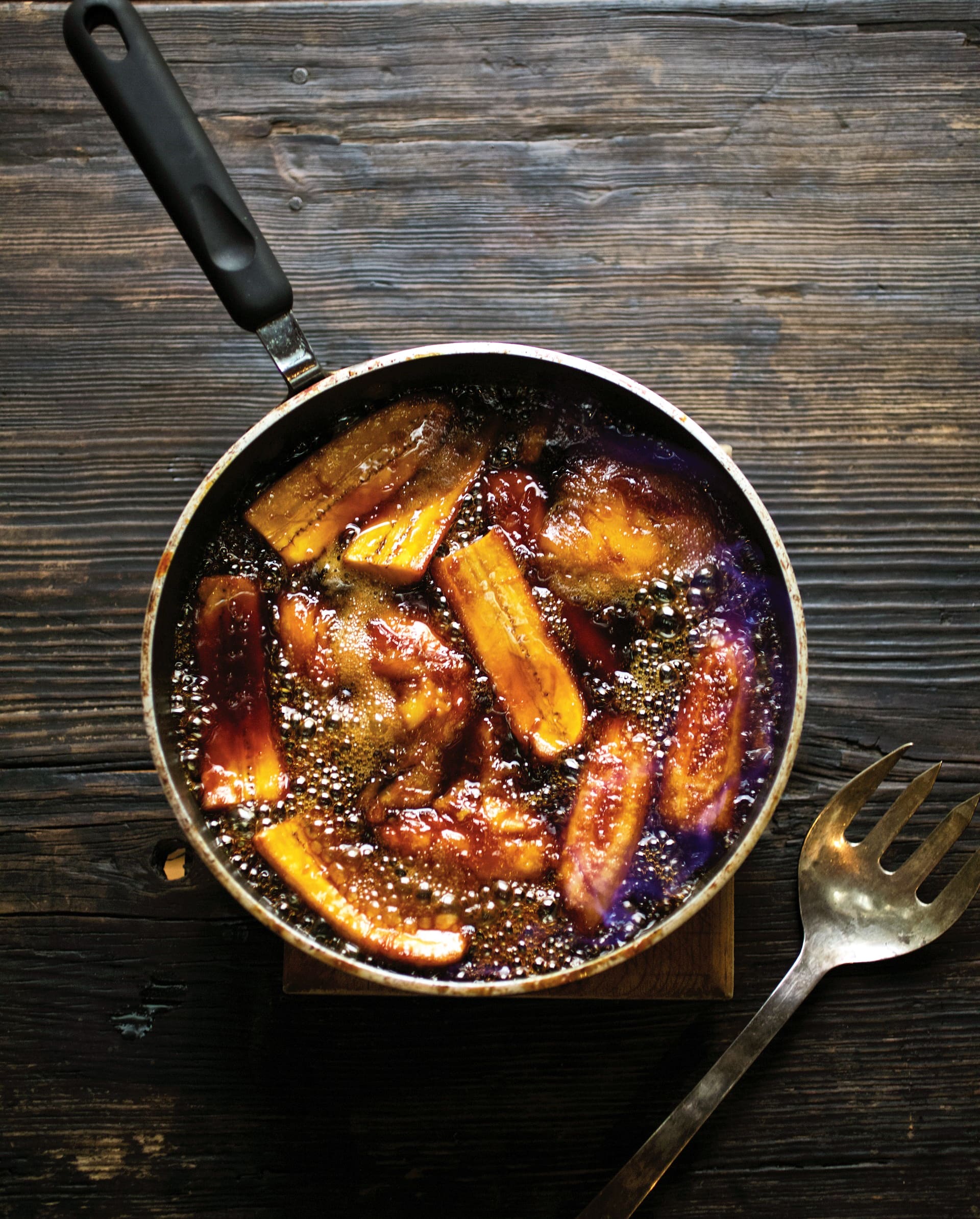 Perfect for Cinco de Mayo dessert, this Mango and Plantain Flambé is a caramelized mango-banana dream made with citrus, mezcal, turbinado sugar, and butter.