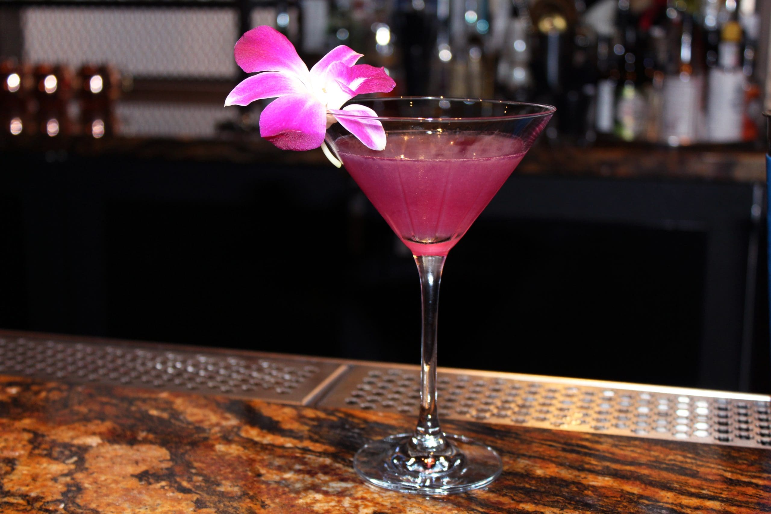 Steps from the French Quarter, Hilton New Orleans Riverside’s speakeasy, Public Belt, features a Color Changing Martini that starts as lilac, darkens to a deep purple, and then changes to a bright fuchsia. The drink is concocted with gin, ginger liquor, simple syrup, and Blure natural flower extract, allowed to darken and then brightened with lemon juice.