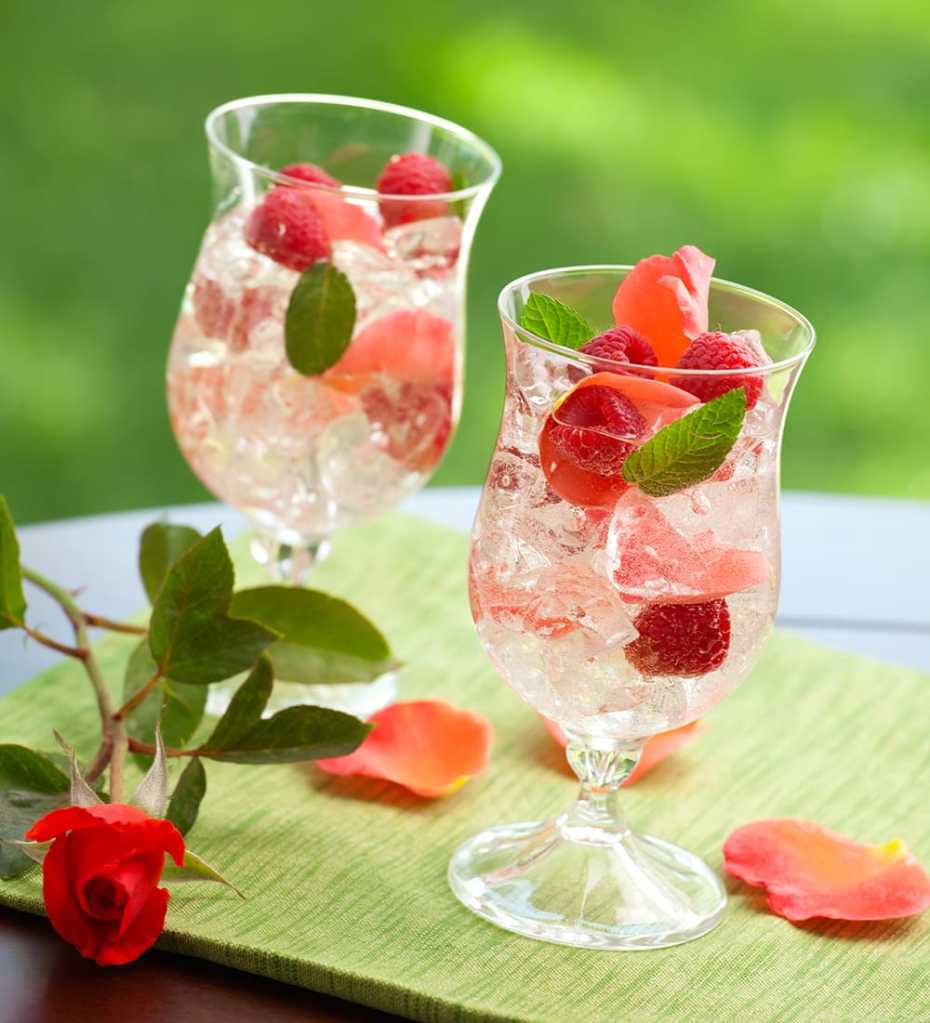 A French Rose Sangria made with rose wine, Grand Marnier, club soda and raspberries.