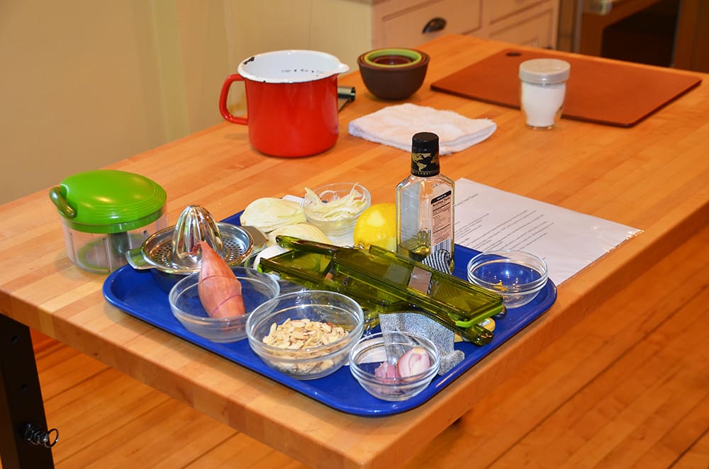 Taking a class at the Savory Spoon is a hands-on lesson in organization, timing, tasting, and teamwork. She starts by reviewing the recipes she’s chosen for the class, pointing them to butcher blocks topped with pre-measured ingredients and explaining how each one works within the recipe.
