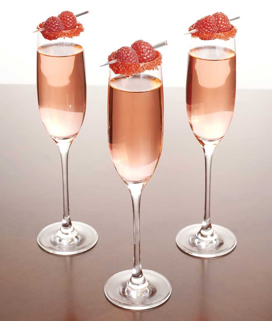 The razzle-dazzle cocktail made with lemon juice, vodka, simple syrup, champagne and raspberries.