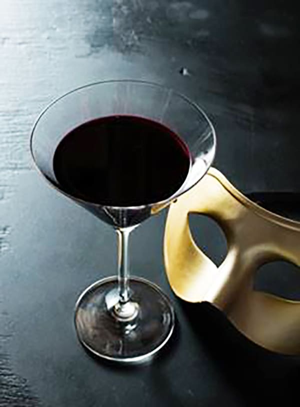 The Absolut Masquerade is made with absolut vodka, black currant juice and chartreuse.