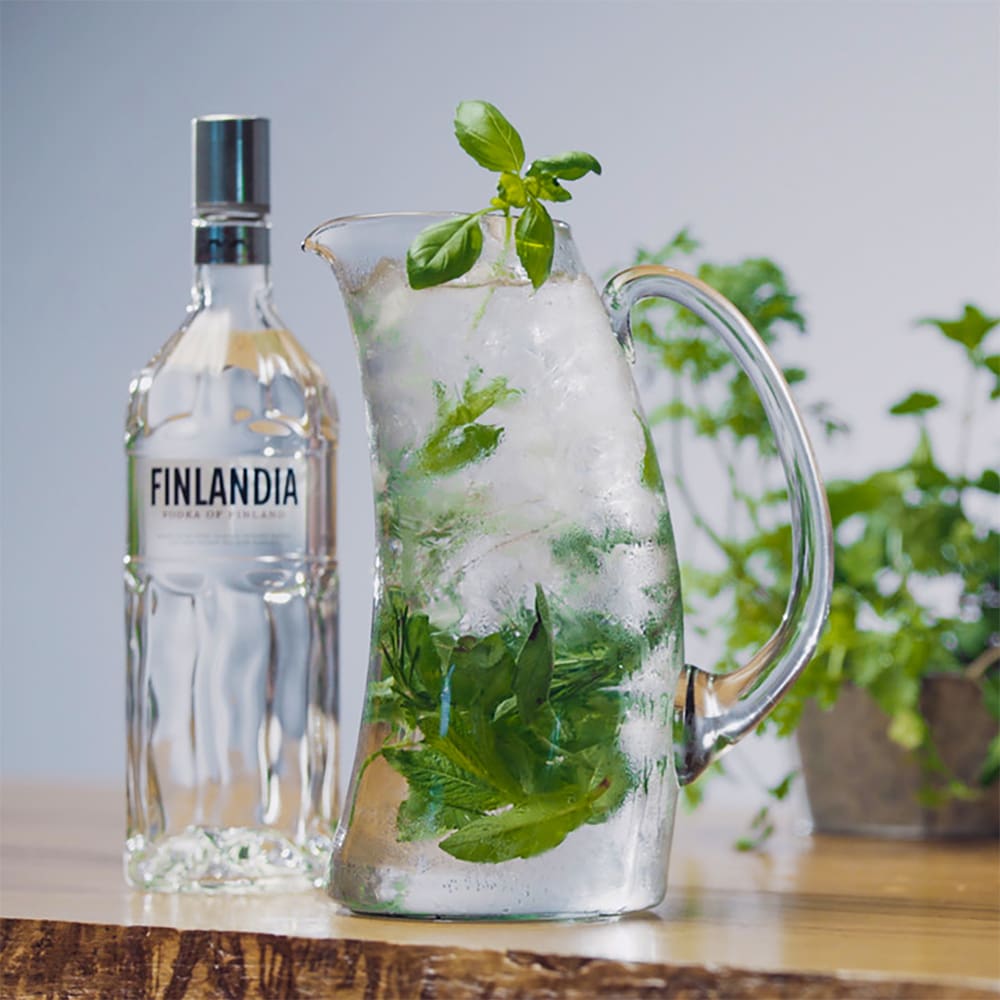 Build the ingredients into a pitcher. Stir. Garnish and serve.