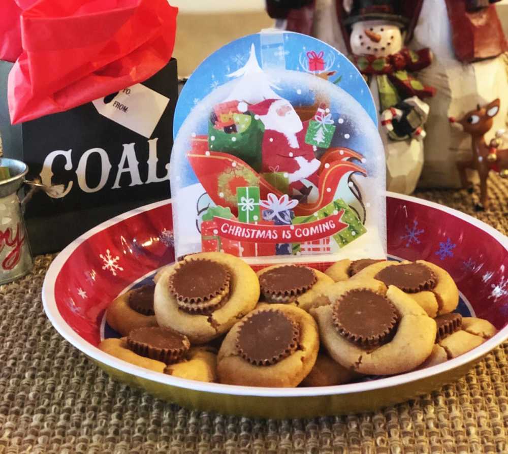 These peanut butter cup cookies are a breeze to make. Basic peanut butter cookies topped with a Reese's peanut butter cup for the perfect chocolate peanut butter blend.