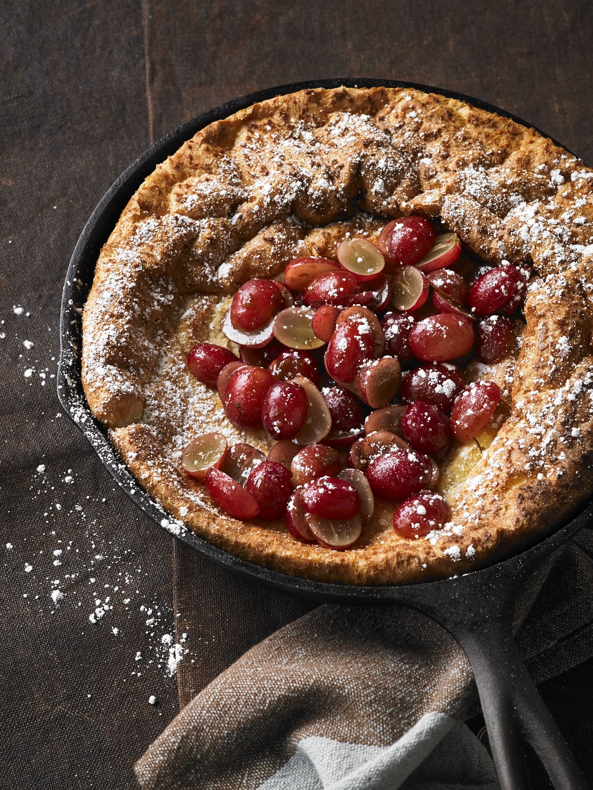 This Grape Dutch Baby is that perfect breakfast dish you envision on a Sunday morning. But don't reserve this just for weekends, it's a perfect way to upscale breakfast anytime you're hosting family or friends.�