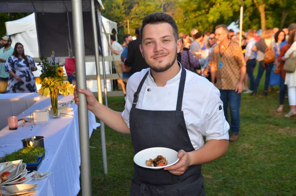 Chef Anton Abrezov shares his culinary techniques and cuisine with guests at the Fayetteville Roots Festival.