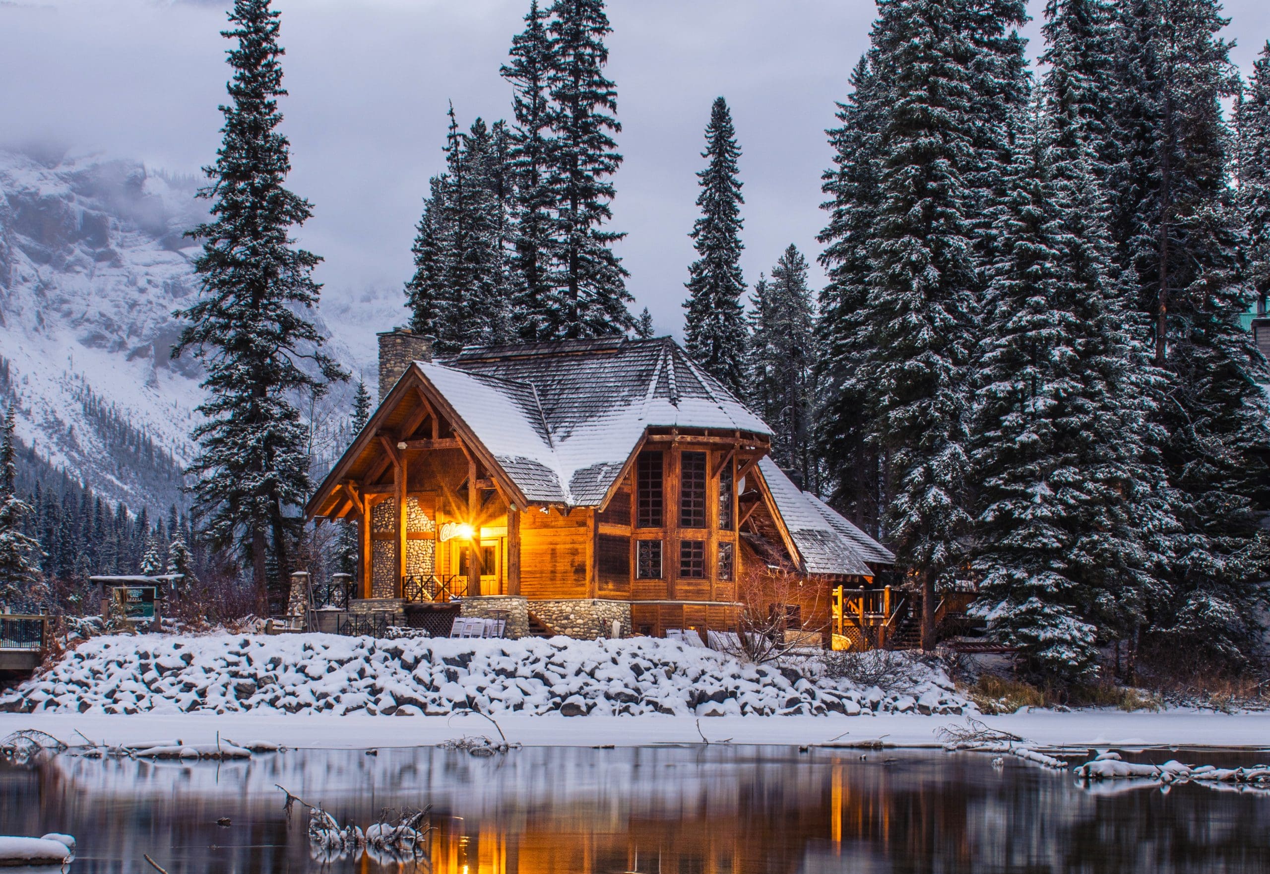 A beautiful home, beside a clear reflective lake, and the perfect setting for enjoying cocktails from Andrea Correal of Elegant Affairs.