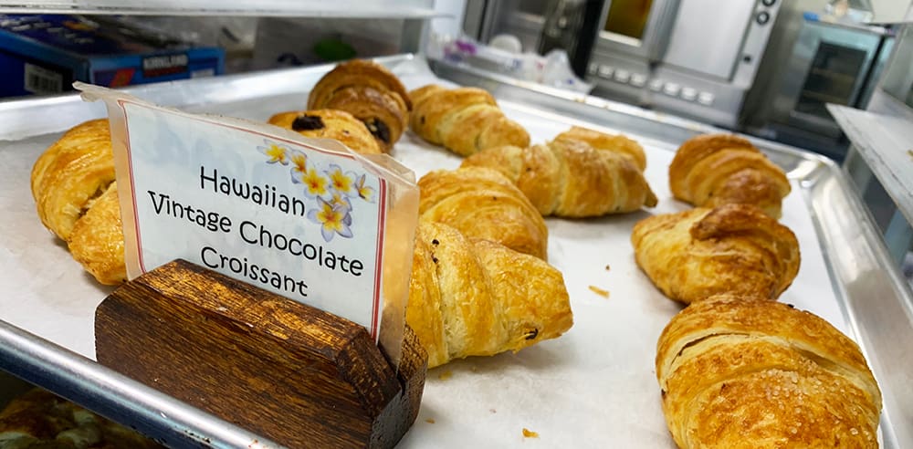 The imaginative croissants are the creation of Chef Judy, who spent most of her culinary career opening resort hotel restaurants across several continents. After years on the corporate side of food, she decided it was no longer for her, and she chose Kaua’i to build a farm-to-table business, with most of her ingredients (with the exception of butter and flour) grown and harvested on the island.