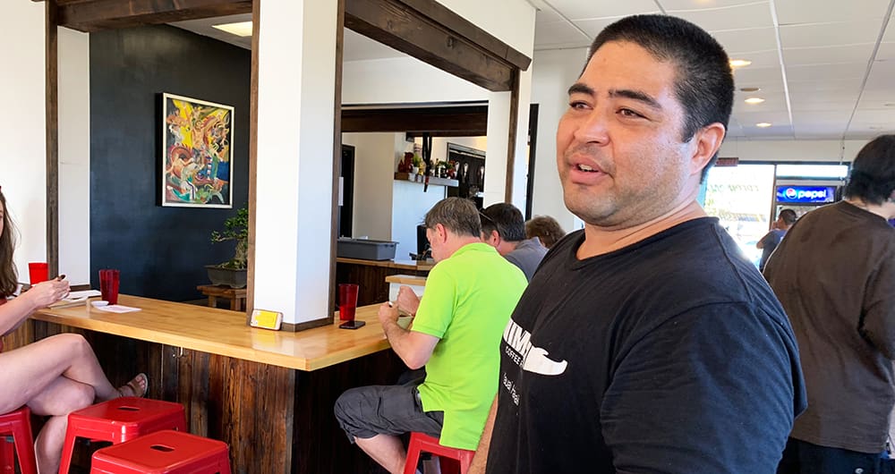 Welcome to Hawaii. Eat something new.” That’s the t-shirt slogan that greeted us at the door of Saimin Dojo, a local noodle shop and more in Kapa’a.  It’s a good philosophy for travelers, and Saimin Dojo is one place to fulfill the command.