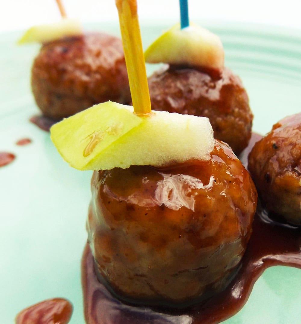 These Purple Cow meatballs will outshine the popular grape jelly meatballs without the jolt of sugar-loaded jelly. The name Purple Cow? The glaze is on the dark purple side, color wise, and the Purple Cow was a restaurant started by my late Uncle Stanley Demuth. He was truly an inspiration to me growing up and he would have devoured these tasty meatballs, as will you.