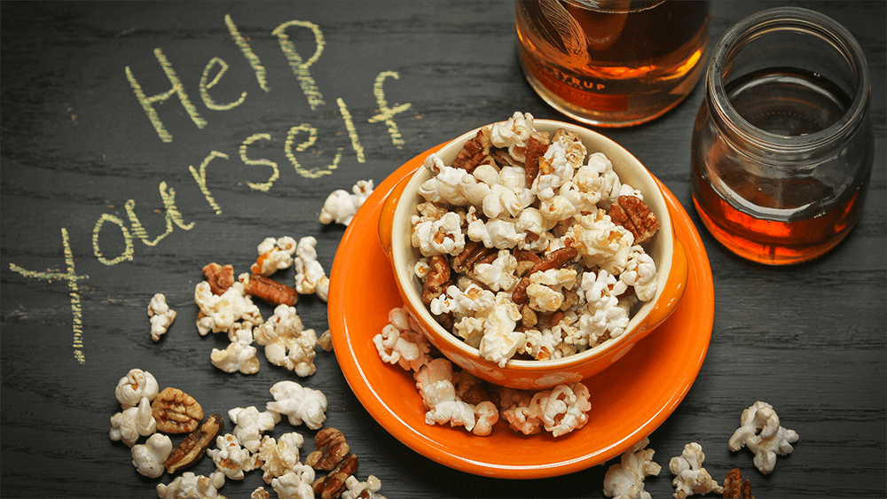 This maple glazed popcorn is perfect for watching the Super Bowl and is made with maple syrup from Runamok.