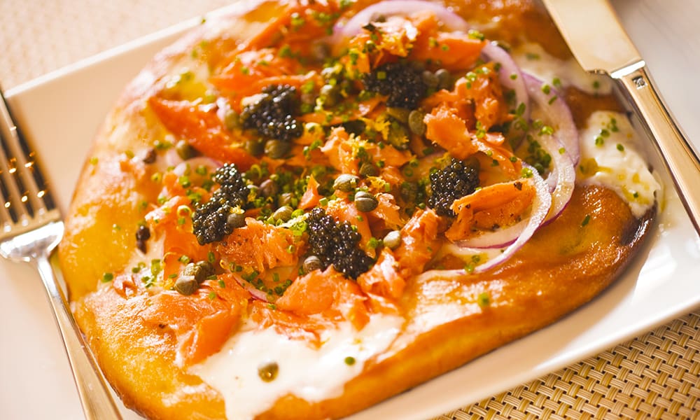 A personal-size smoked-salmon pizza, crafted in the style served by Wolfgang Puck at his famous Spago restaurant. Perfect for an upscale Oscar party treat.